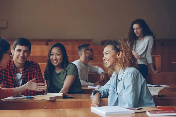 Students discussing a project around a table